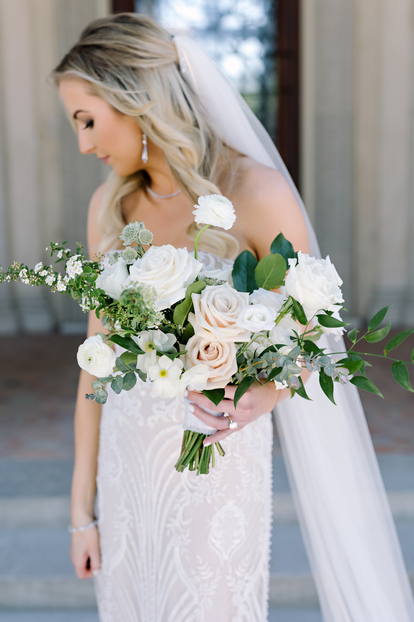 Bride in a lace gown by Adam Zohar, bouquet by Gypsy Floral