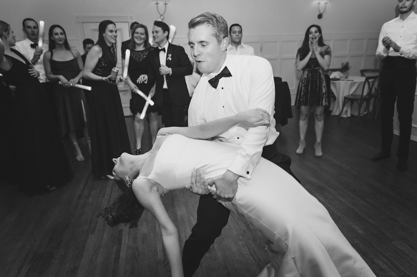 Groom dipping his bride during the wedding reception