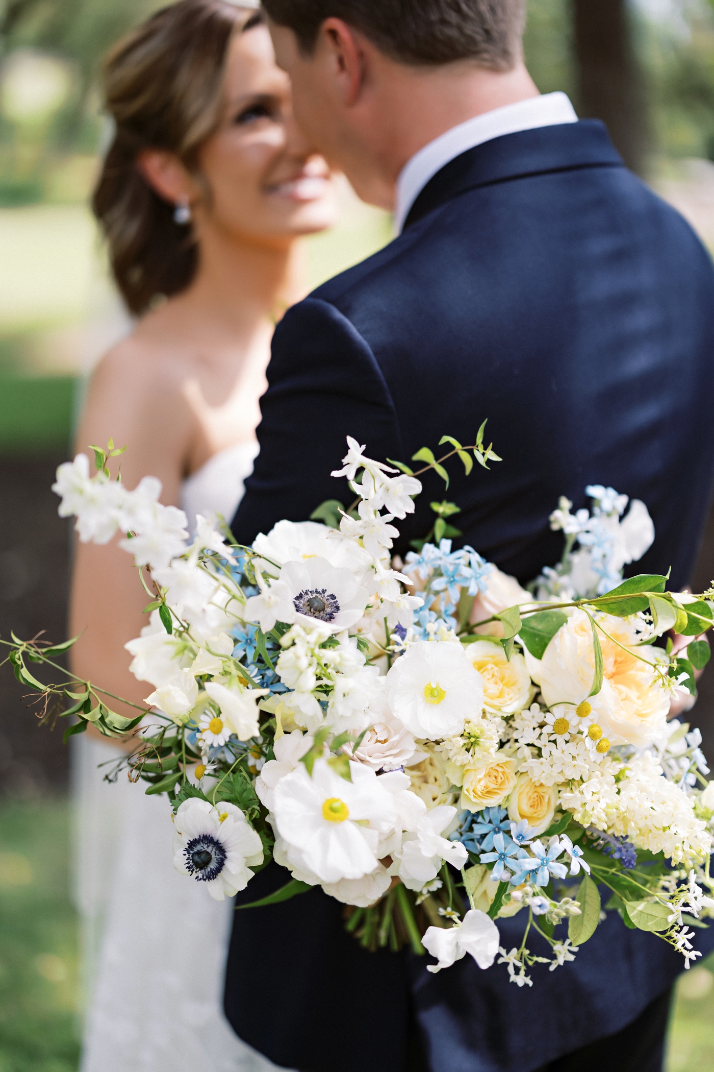 Organic white, blue and yellow bridal bouquet by Stems Floral