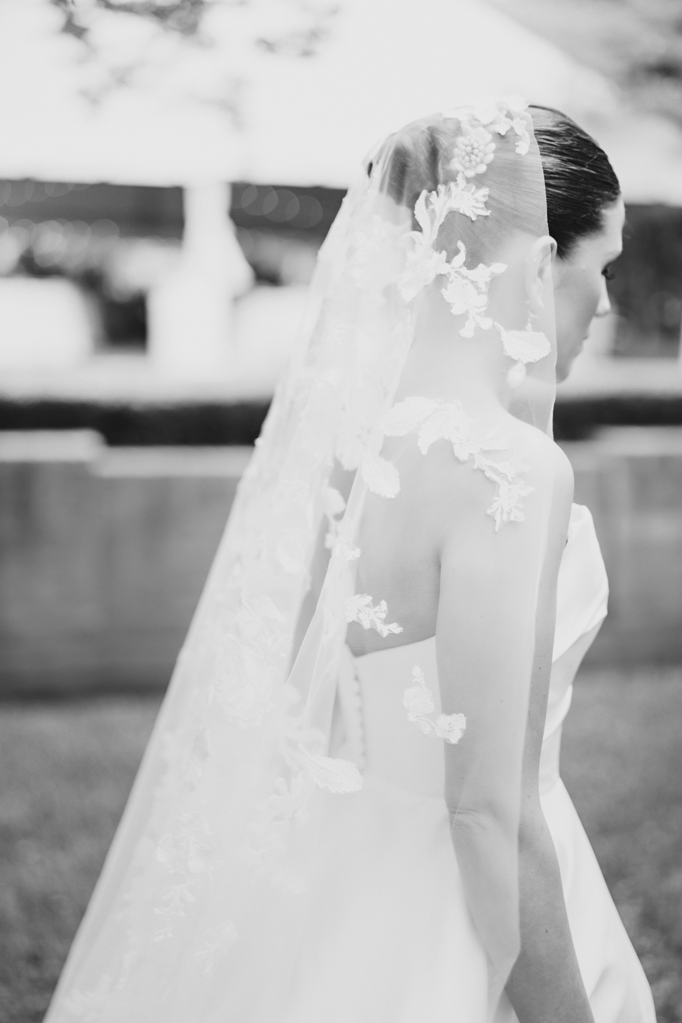 Black and white portrait of a bride with a lace veil