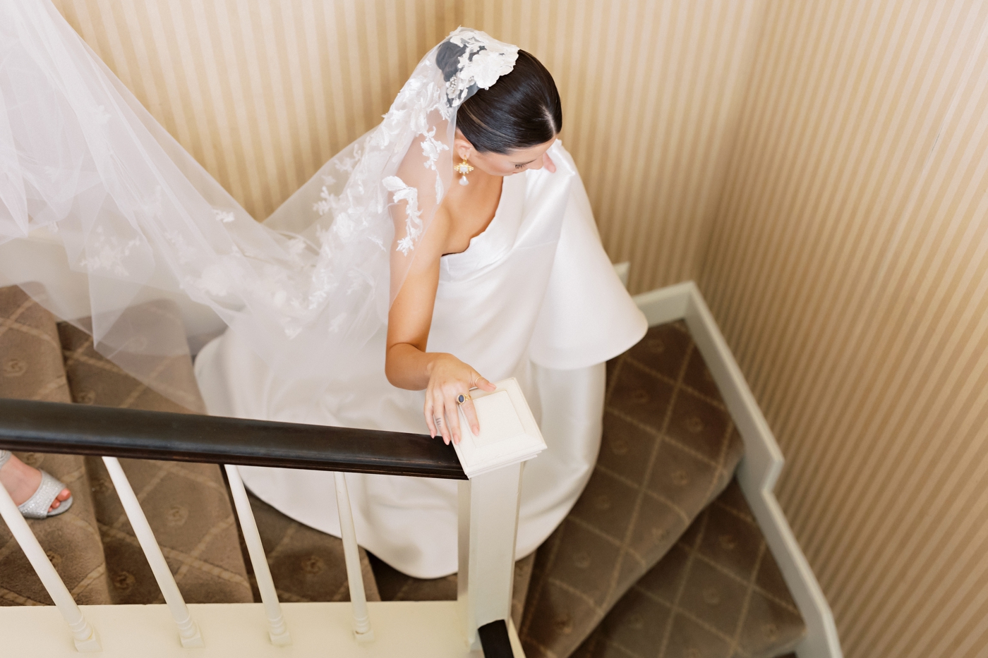 Bride walking down the stairs before her wedding