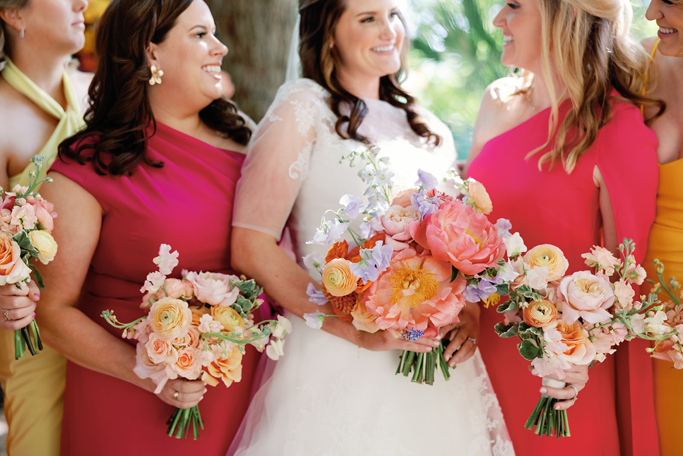 Colorful spring wedding bouquets with coral charm peonies and ranunculus by Stems Floral