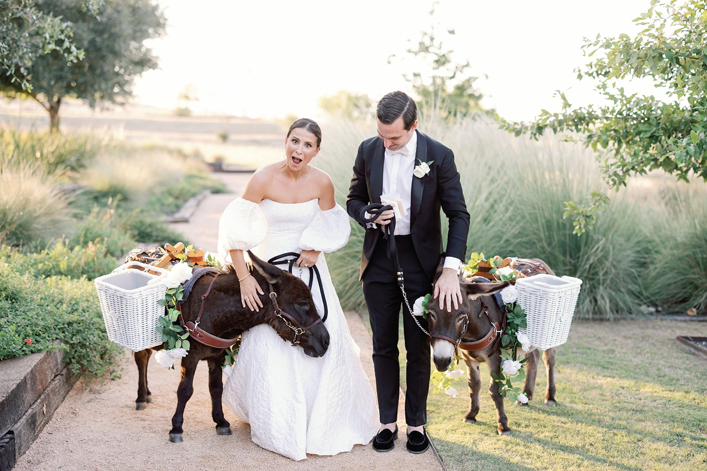 Bride and groom outside with Beer Burros during their cocktail hour at Two Wishes Ranch