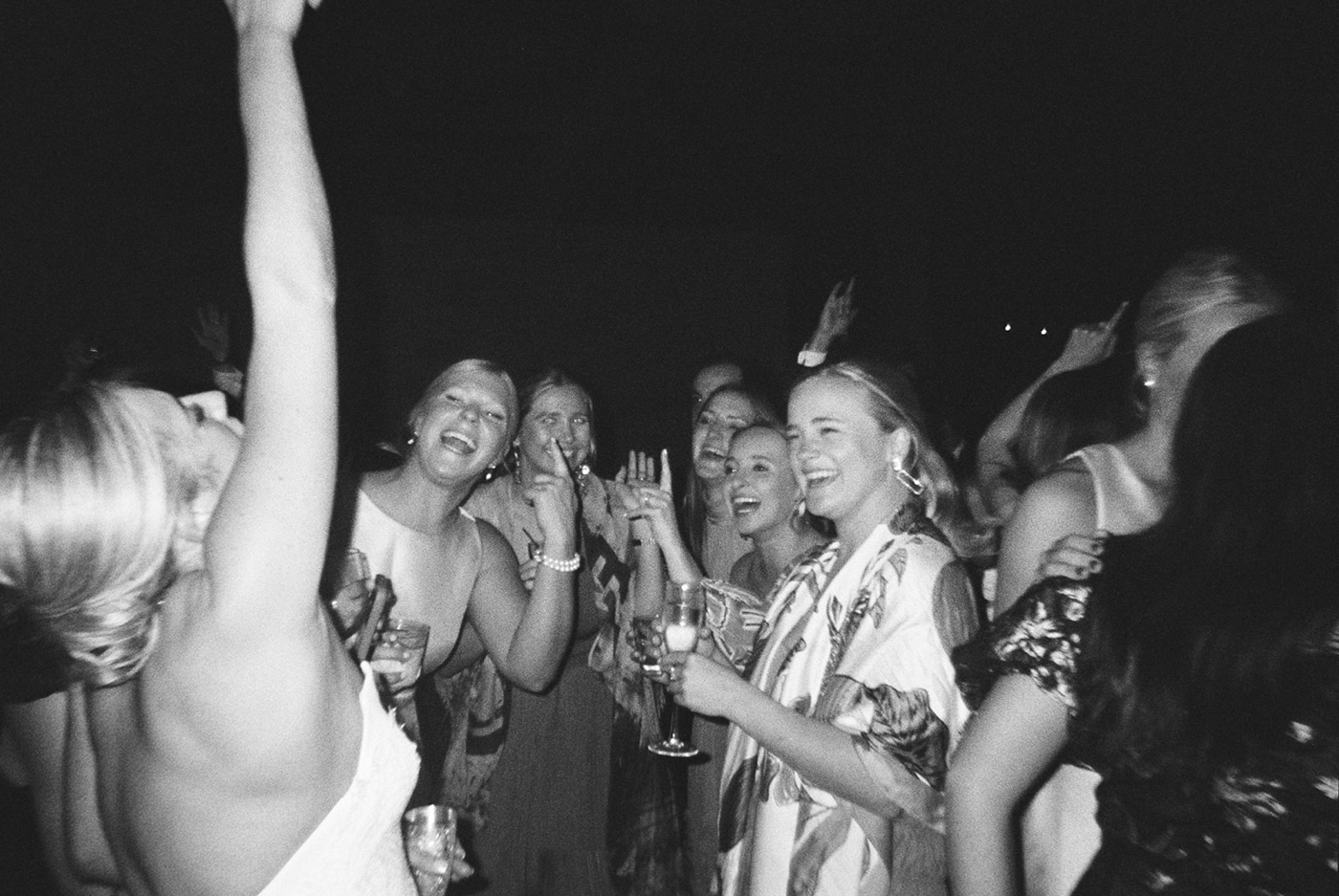 Family and friends dancing at an Austin wedding, captured on film