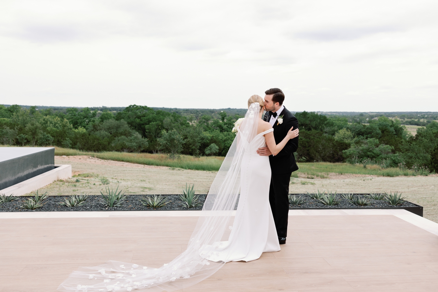 Bride and groom first look at a home in Fredericksburg Texas, overlooking the Hill Country