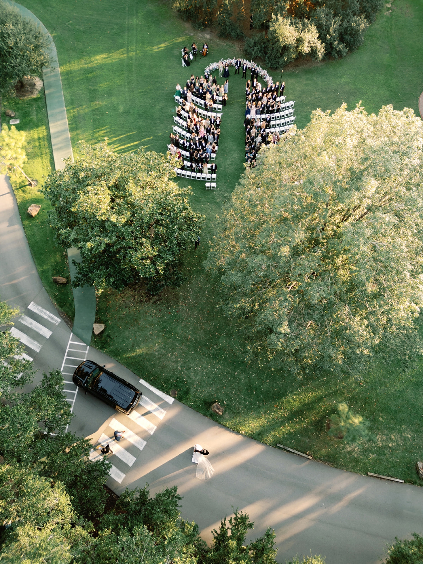 Bride and groom at Christian ceremony under Texas live oak tree at The Houstonian.