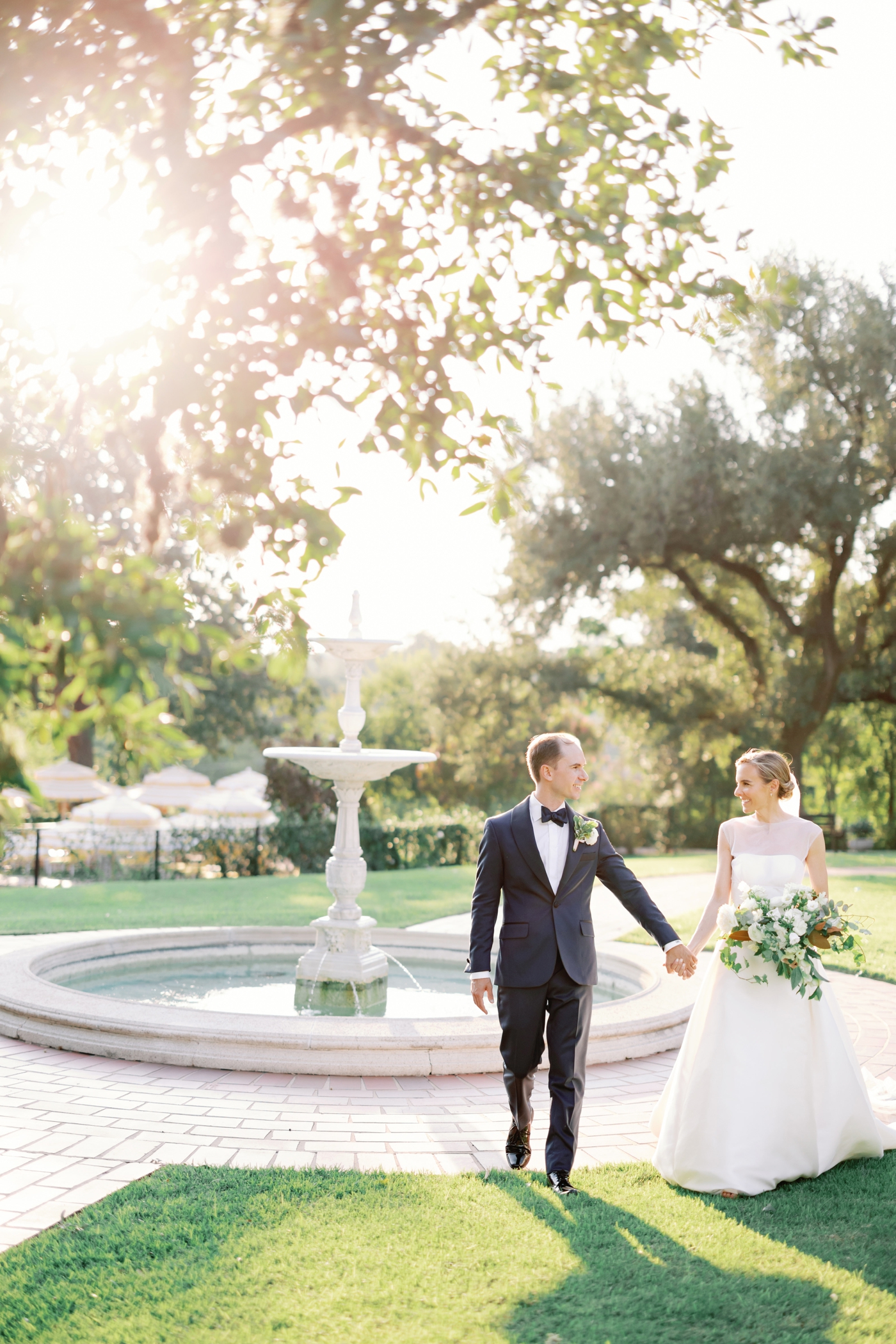 Golden hour bride and groom pictures on the lawn of Commodore Perry Estate in Austin, Texas