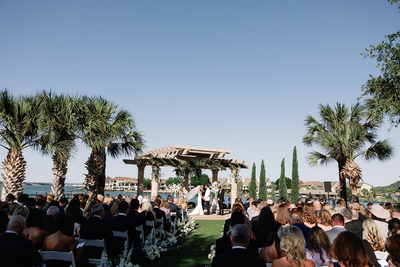 A wedding ceremony on LBJ Lake, on the Falls Point Lawn at Horseshoe Bay Resort