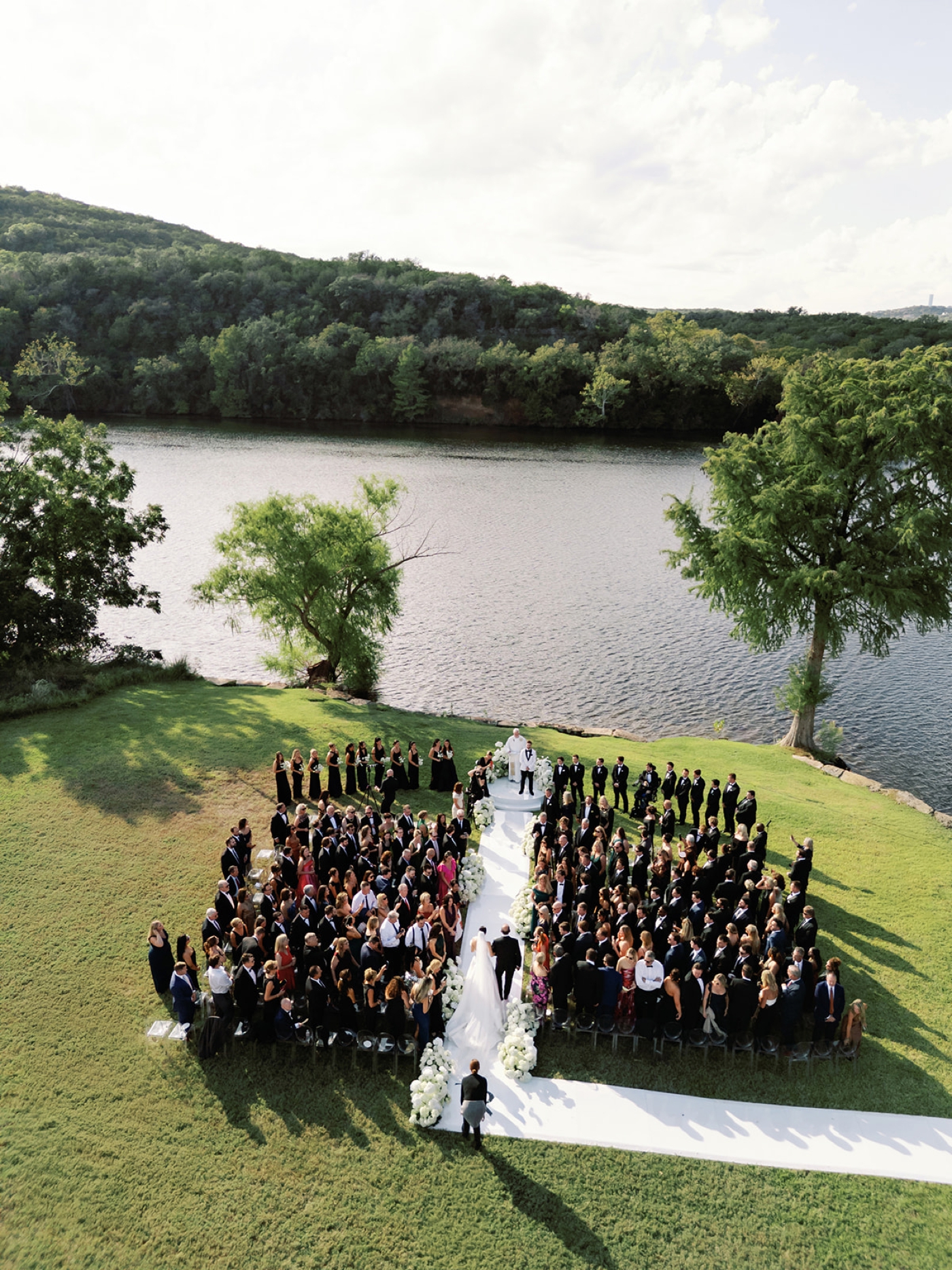 An overhead view of a wedding ceremony overlooking Lake Austin