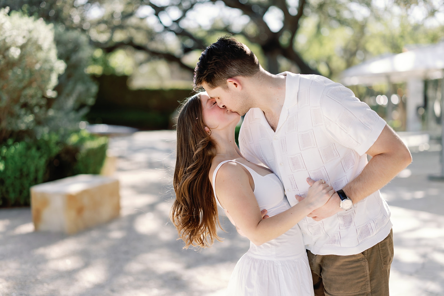 A man dipping his fiance, for portraits in Fredericksburg, texas