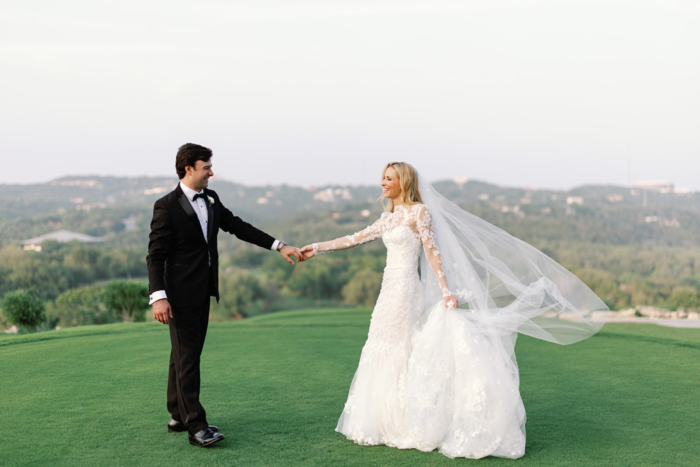 Newlywed portrait overlooking the Texas Hill Country at Omni Barton Creek Resort, at sunset