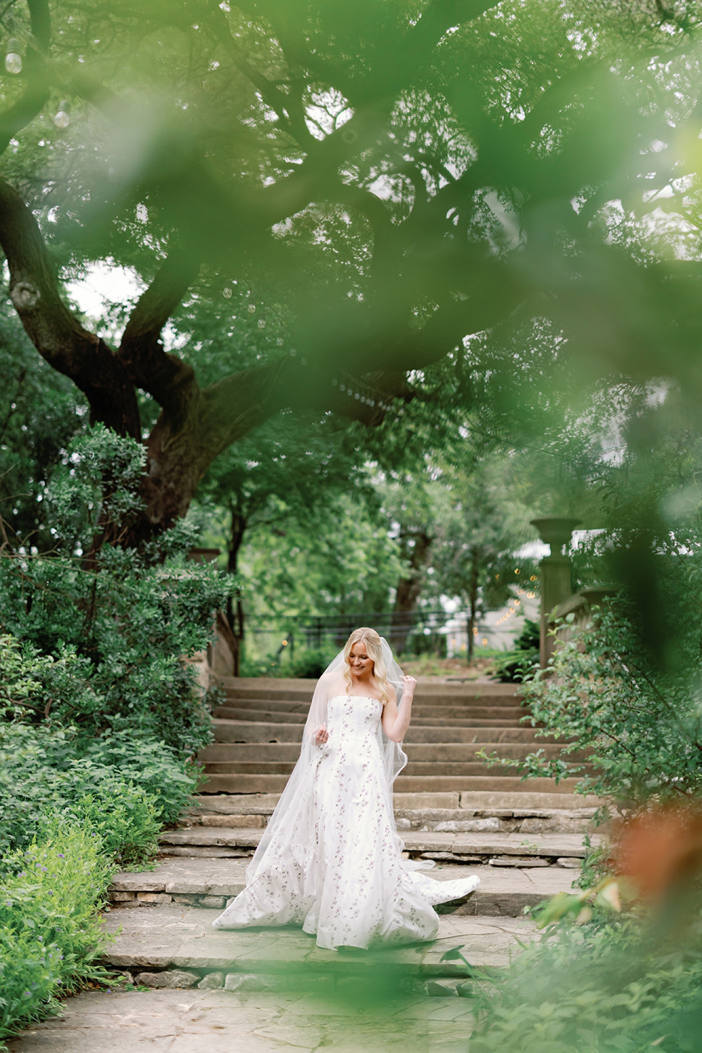 A bride walking down the garden at Laguna Gloria