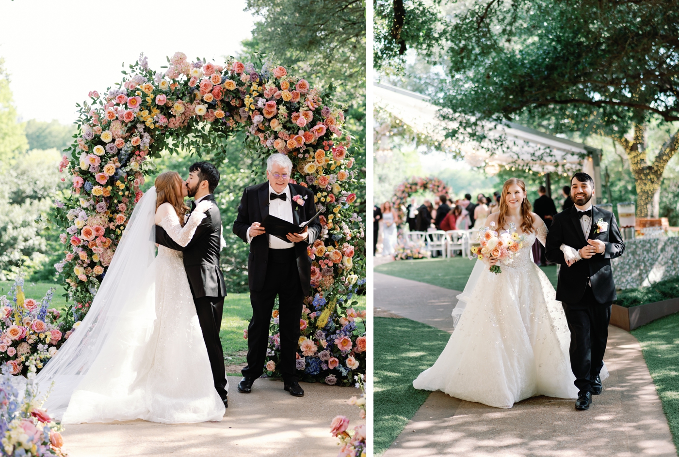 Bride and groom sharing first kiss under a full circular floral arch in coral, peach, lavender and yellow at a Four Seasons Austin garden wedding